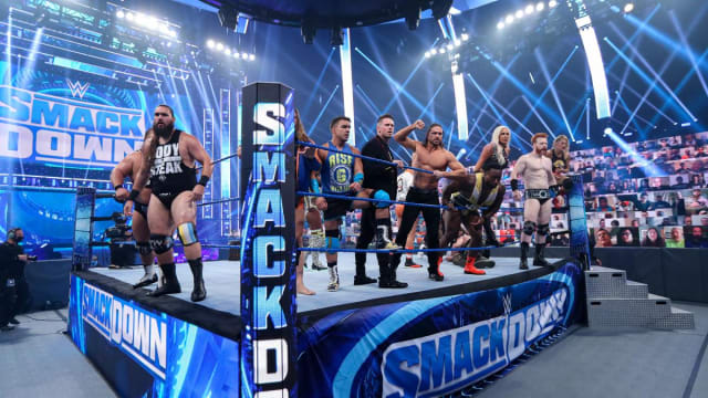 A slew of WWE superstars inside the ring for an episode of Friday Night SmackDown.